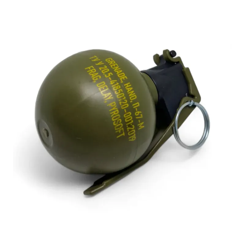 Grenade Pyrosoft P-67-M NATO couchée, marquage jaune du corps sphérique et anneau de goupille