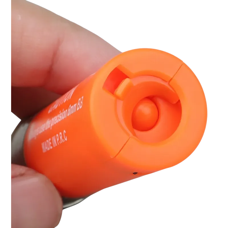 Cartouche orange Wosport pour fusil à pompe airsoft, gros plan de la sortie des billes