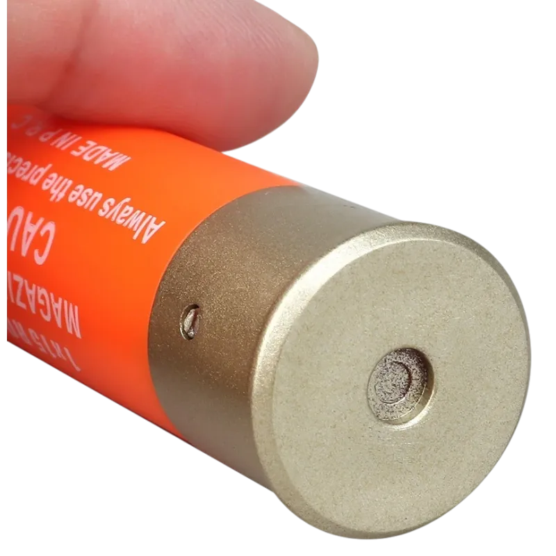 Cartouche orange Wosport pour fusil à pompe airsoft, culot doré en gros plan