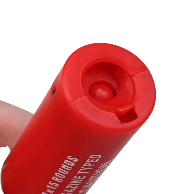 Cartouche rouge Wosport pour fusil à pompe airsoft, gros plan de la sortie des billes